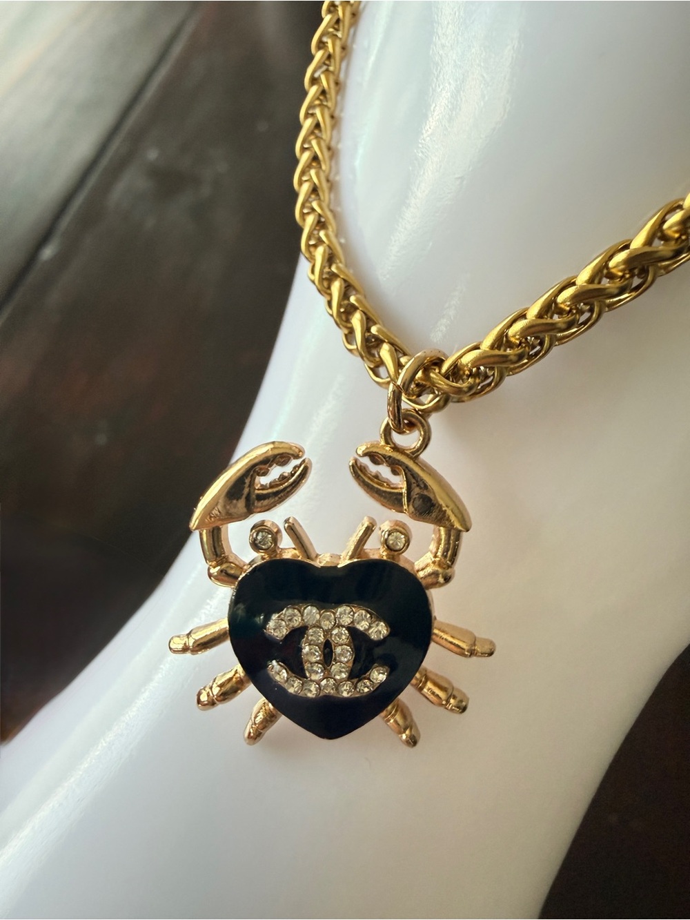 Chanel gold-tone stamped
Crab in black enamel & Chrystal
On 7” round wheat chain